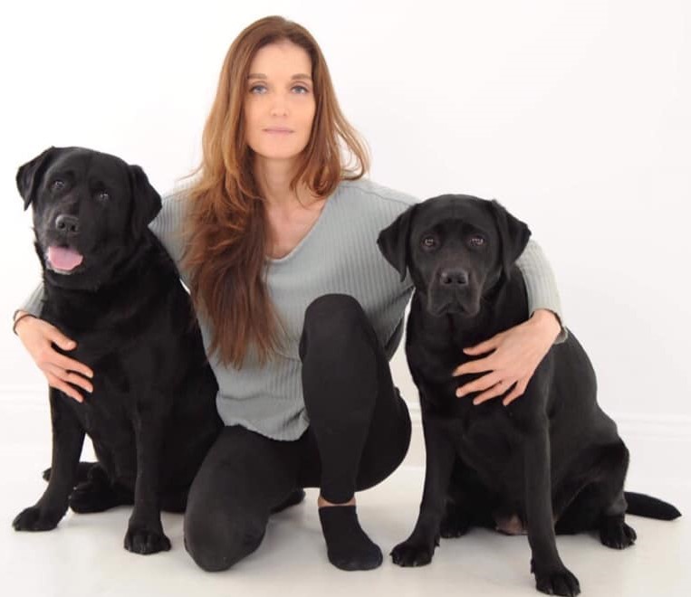 The post's author, Anna Bradley, with two dogs