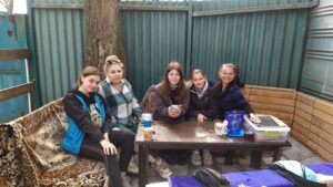 Picture with staff at a table waiting for their shift to start - Equine Court