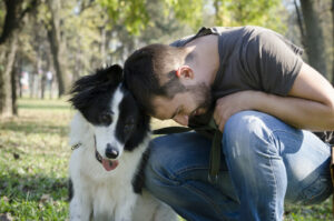 When a dog is leaning into a person to initiate closer contact it ndicates a “yes.” Photo (c) CanStock Photo