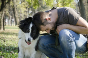 Dog leaning into man